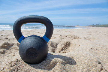Kettebells at the sunny beach