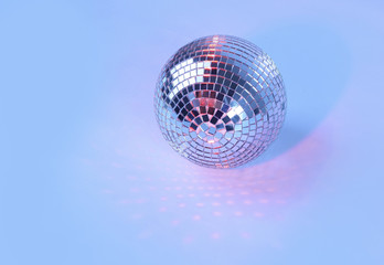 beautiful disco ball on yellow background isolated.