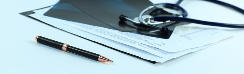 stethoscope and x-rays on a white background