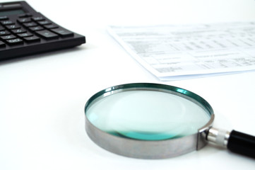 magnifier and coins