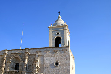 Fototapeta na wymiar Gorgeous Belfry and Facade of the Church of Saint Augustine in Arequipa, Peru, South America