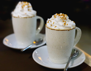 Two glasses of coffee with whipped cream