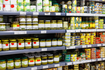 Interior view canned food products in cold storage  store.