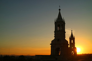 Silhouette of the Iconic Bell Tower of Basilica Cathedral of Arequipa against the Setting Sun, Peru