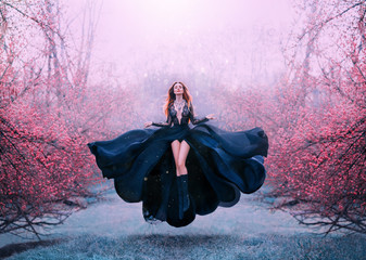 gorgeous red-haired hot woman in long flying black dress fluttering, witch turns into crow, dark...