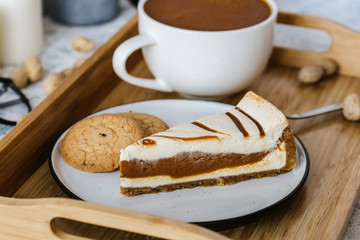 Dessert for a cup of coffee: a piece of chocolate, caramel cake