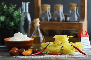 Pasta uncooked on the table. Noodles in the form of nests.