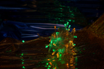 Multicolored garland on a dark background