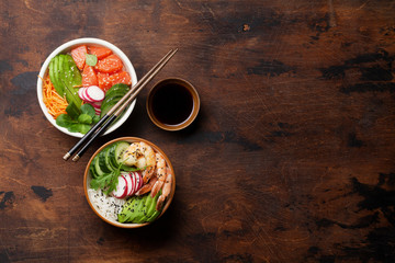 Poke bowl with salmon, shrimps and vegetables