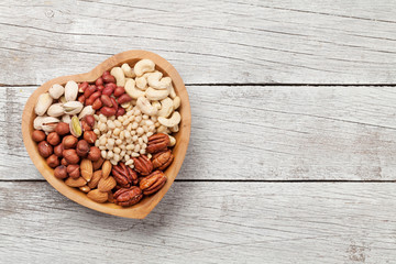 Various nuts selection on wooden table