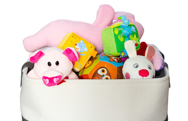 Toy Box full of soft toys isolated on white