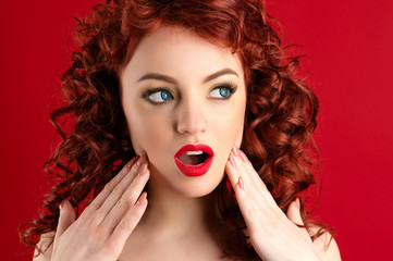 Fototapeta premium beautiful surprised woman with bright makeup and curls
