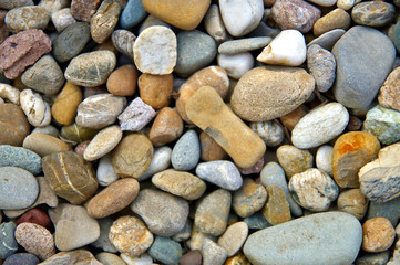 Sea pebbles background. Stones seamless pattern. seamless background with smooth pebble. Natural colors seaside pebble.  Spa stones flat design. colorful beautiful stones background texture 