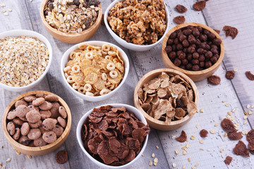 Bowls with different sorts of breakfast cereal products