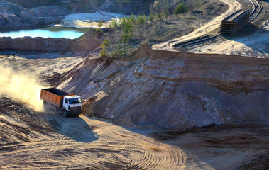 Mining dump truck transports sand and other minerals in the quarry. © MaxSafaniuk