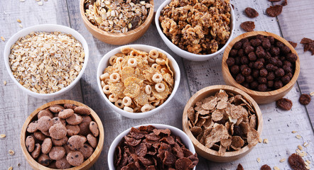 Bowls with different sorts of breakfast cereal products