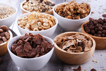 Bowls with different sorts of breakfast cereal products