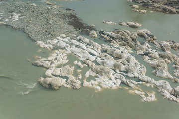 Big rocks and boulders in the river. Fast current. The texture of the water. Rest in Georgia. River...