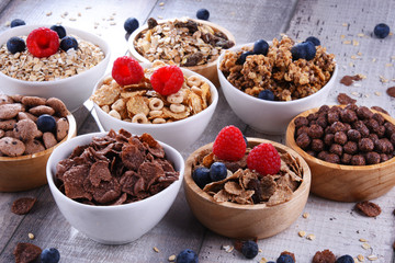 Bowls with different sorts of breakfast cereal products