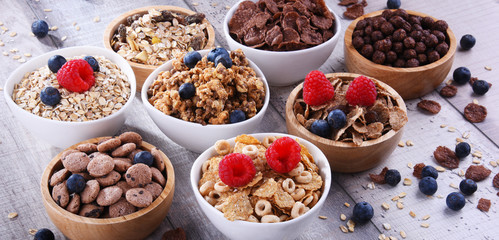 Bowls with different sorts of breakfast cereal products