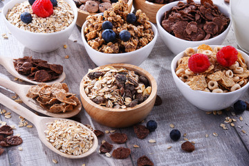 Bowls with different sorts of breakfast cereal products