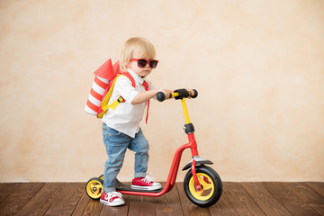 Happy child playing with toy rocket at home © Igor Yaruta
