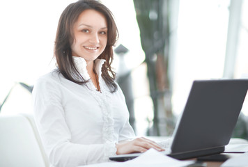closeup. modern business woman working with documents sitting at her Desk