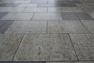 Gray granite. Rectangular pavement slab. Perspective view.