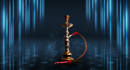 Hookah smoking on a dark abstract background. Background of empty scenes with neon lights and colored lights, reflection of night lights on wet asphalt