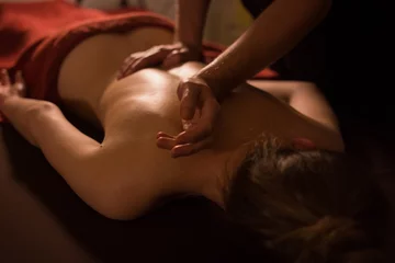 Masseur hands doing back massage in spa center © happy_finch