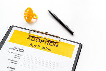 Application to adopt child with dummy on white background
