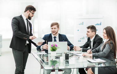 business partners discuss the profits before signing the new con