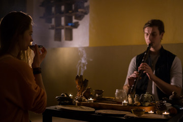 Man playing japanese bamboo flute - shakuhachi