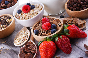 Bowls with different sorts of breakfast cereal products