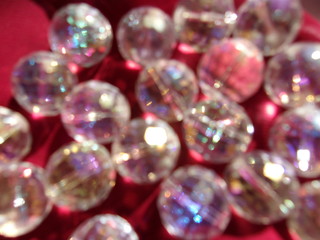 blurred sparkling background. crystal ball. round glass beads. play of light