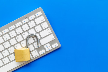 protect information from cyber attack with locker and keyboard on blue background top view mockup