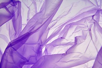 Plastic bag. Purple background. The color splashing. Texture for Valentine day or wedding