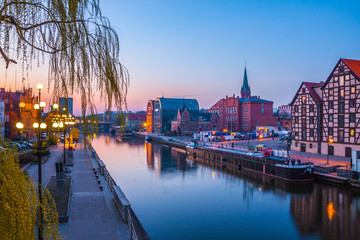 Fototapeta na wymiar Bydgoszcz old town at amazing sunrise with reflection in Brda river. Bydgoszcz. Poland