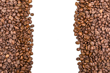 Vertical frame of roasted coffee beans isolated on white may use as background or texture. Copy space for text.