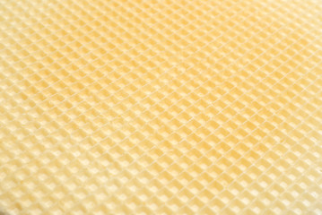 Fototapeta premium Tasty wafer as background, closeup. Crispy food