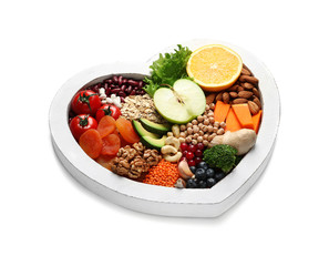 Heart shaped tray with healthy products on white background