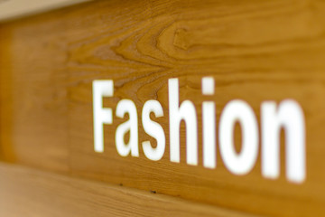 The fashion look word text written on on wooden background, quote, sign, Lettering, concept, blurred background