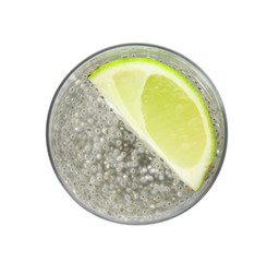 Glass of water with chia seeds on white background, top view