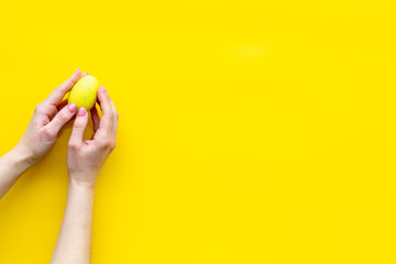 eggs with colorful paint for easter tradition on yellow background top view mockup