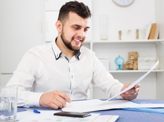 Young male preparing to signing financial agreement