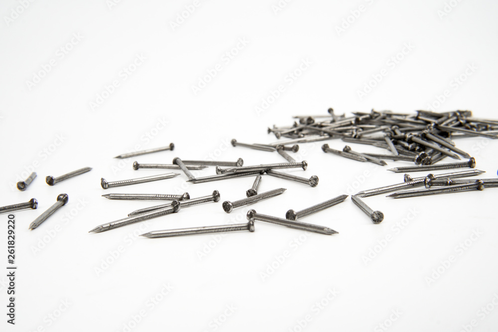 Wall mural bunch of metal nails on white background