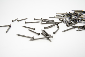 Bunch of metal nails on white background