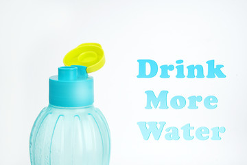 Blue plastic water bottle with text on a white background 