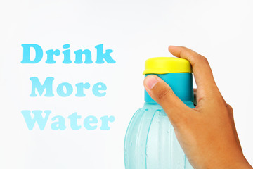 Hand holding blue plastic water bottle with text on a white background 