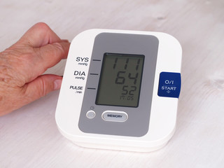 Digital blood pressure monitor showing low heart beat